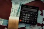 a calculator sitting on top of a wooden table