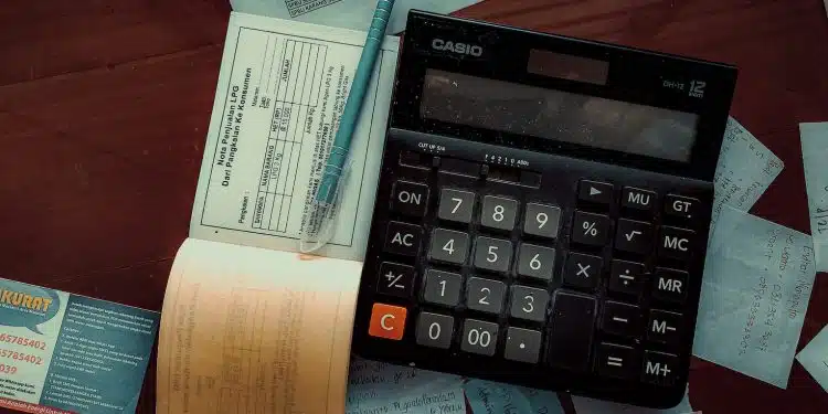 a calculator sitting on top of a wooden table